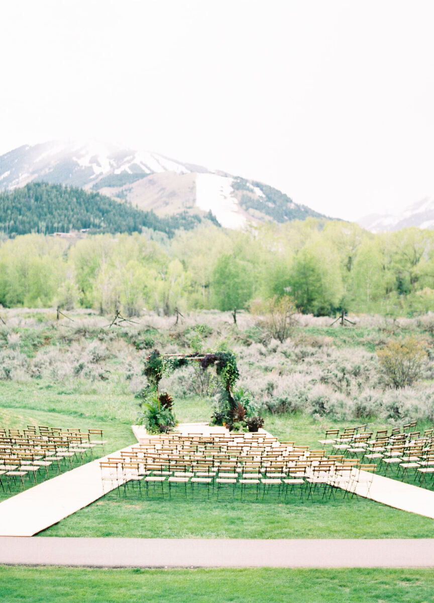 Wedding Aisle: An outdoor ceremony set-up with two aisles intersecting at the altar and the mountains in the background.