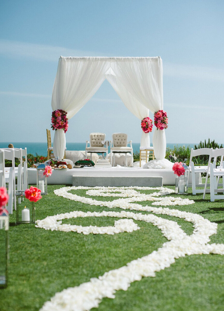 Wedding Aisle: An outdoor wedding aisle with a unique pattern created from flower petals.