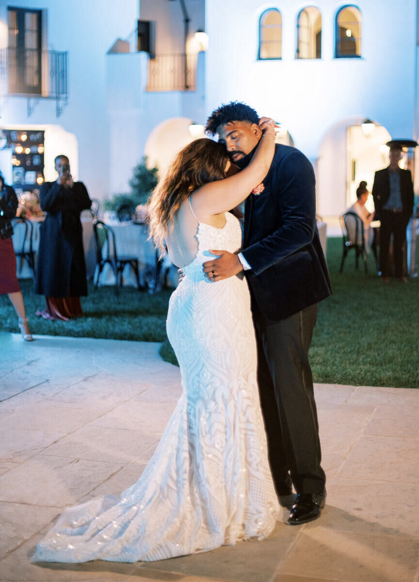 Wedding details: A bride and groom during their first dance.