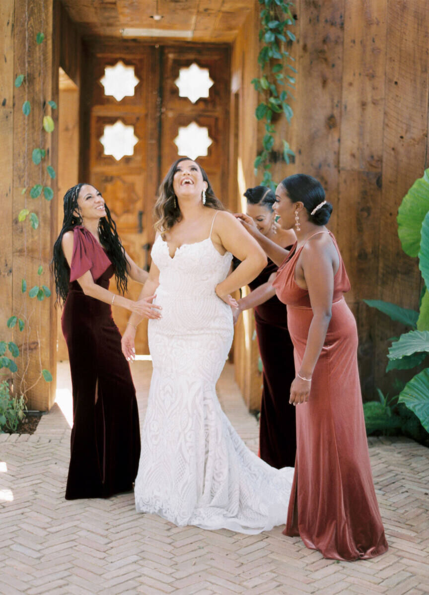 Wedding details: A bride and her bridesmaids laughing together.