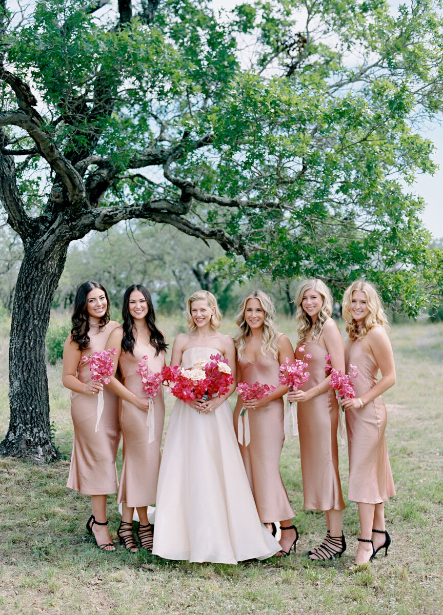 Pink wedding details: A bride and her bridesmaids, which included her sister-in-law who served as the wedding planner.