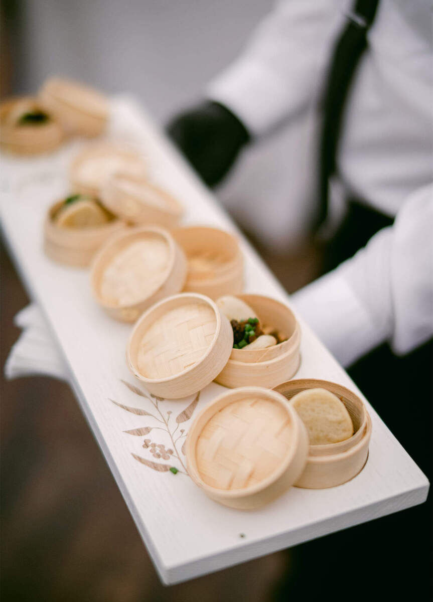 Wedding details: Small steamer baskets hold passed appetizers.