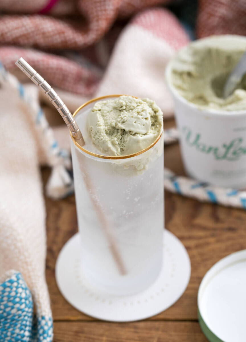 Wedding Drinks: A cocktail in a tall glass with a silver straw and scoop of pistachio ice cream on top.