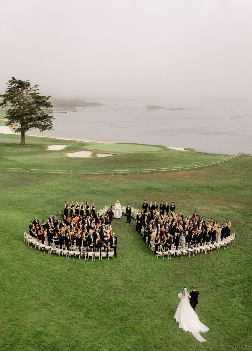 Wedding Photography Ideas: A bride and her father walking toward a wedding ceremony setup on a golf course overlooking the ocean in Northern California.