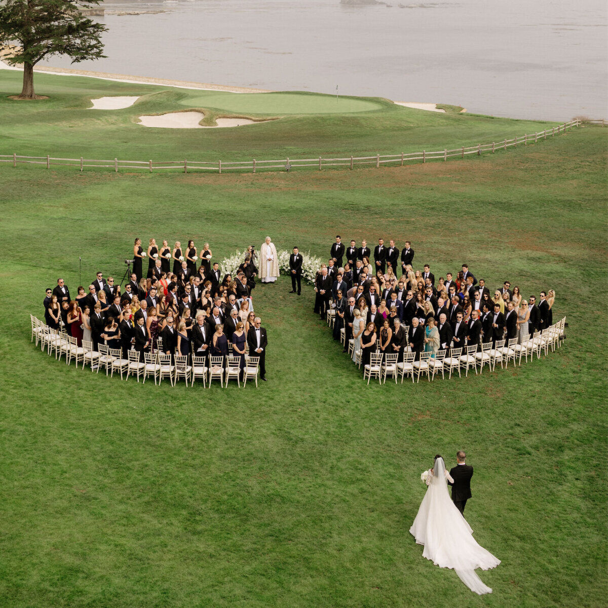 Wedding Photography Ideas: A bride walking toward an outdoor wedding ceremony in Pebble Beach, California.