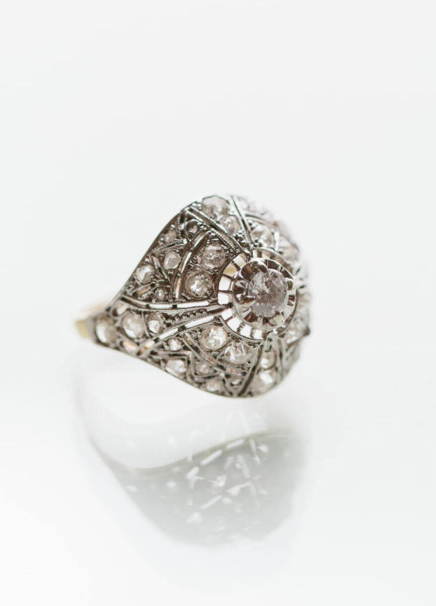 Wedding Ring Design: A vintage-inspired engagement ring against a plain white background.