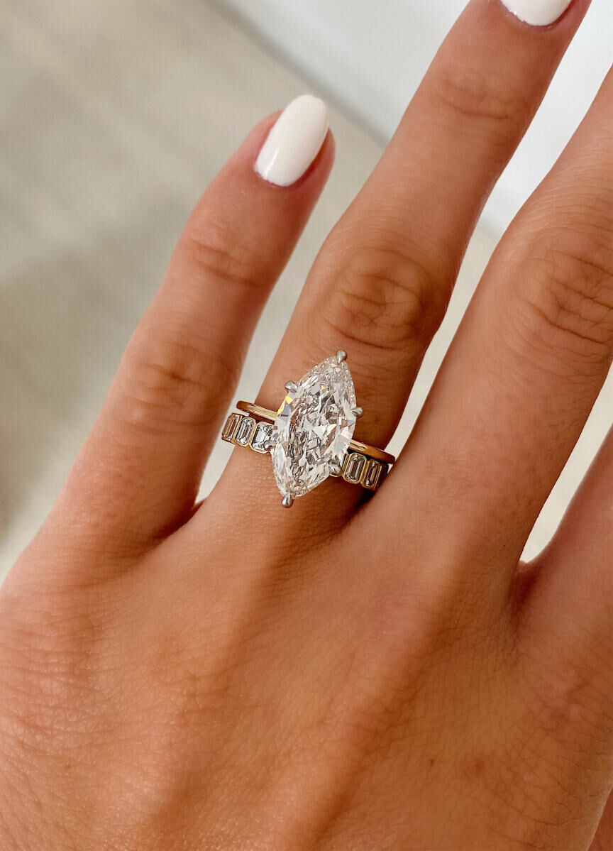 Wedding Ring Design: A marquise engagement ring being worn on a ring finger.