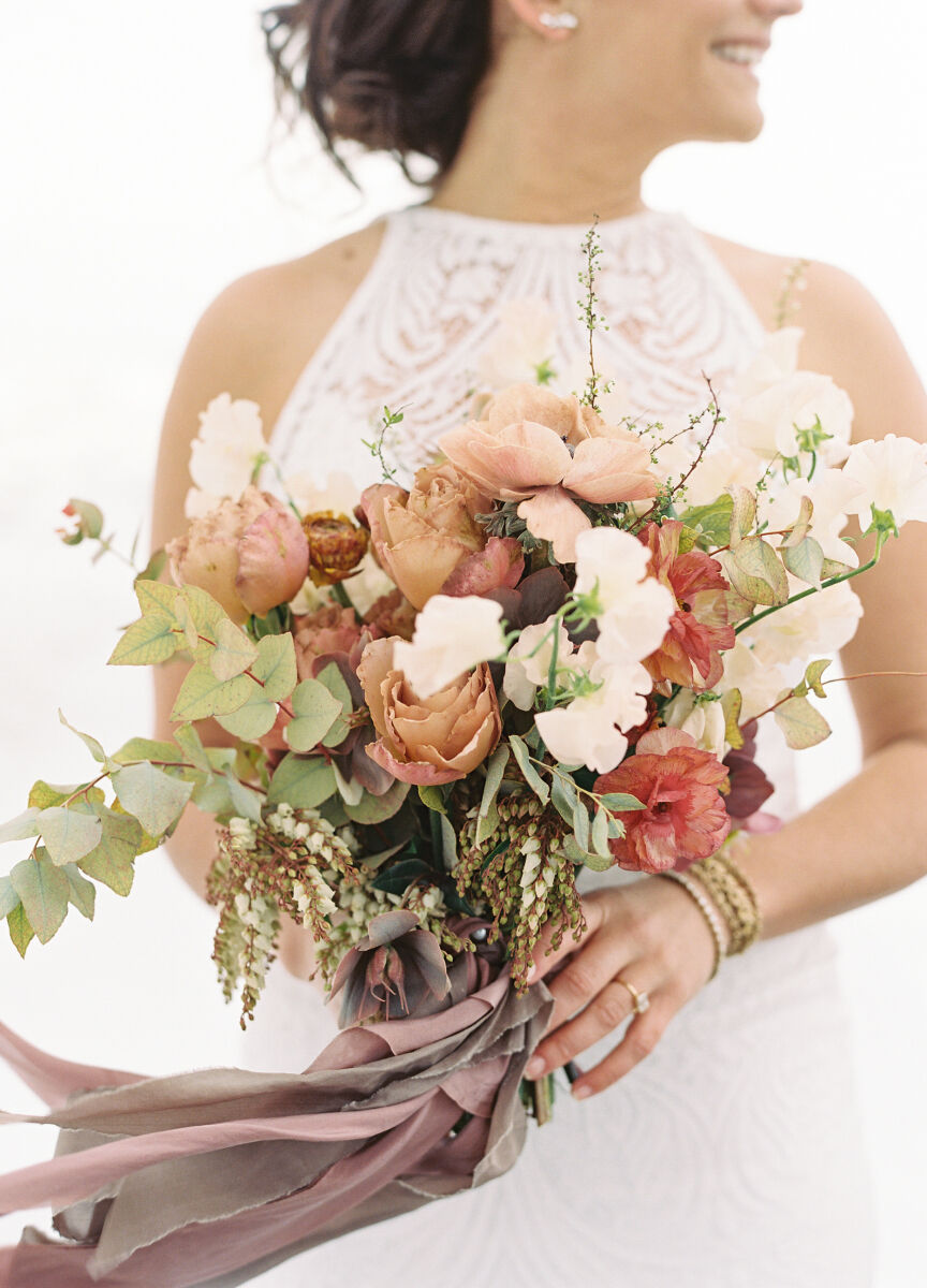 Wedding vendor: See more wedding flowers from Tinge Floral, who created this organic winter wedding bouquet.