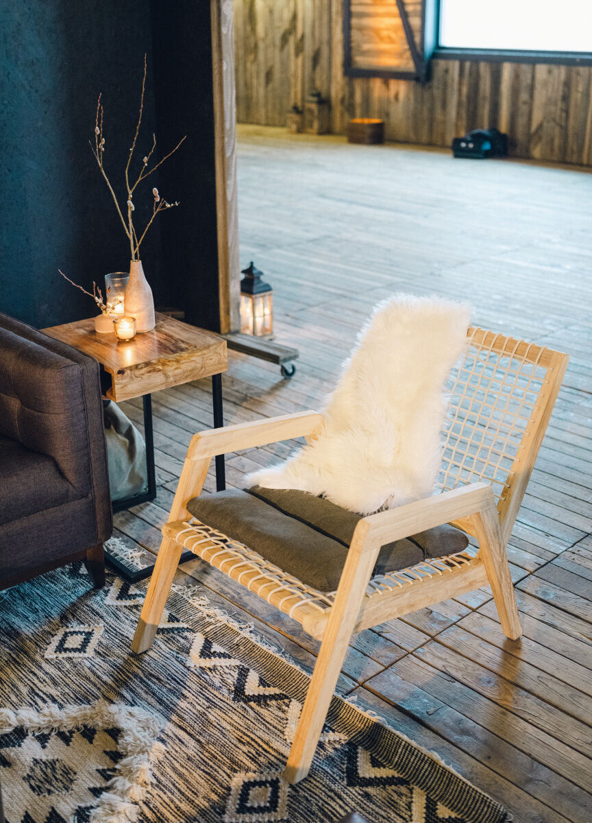 This winter wedding had cozy accents like warm throws, layered rugs, and lots of candlelight.