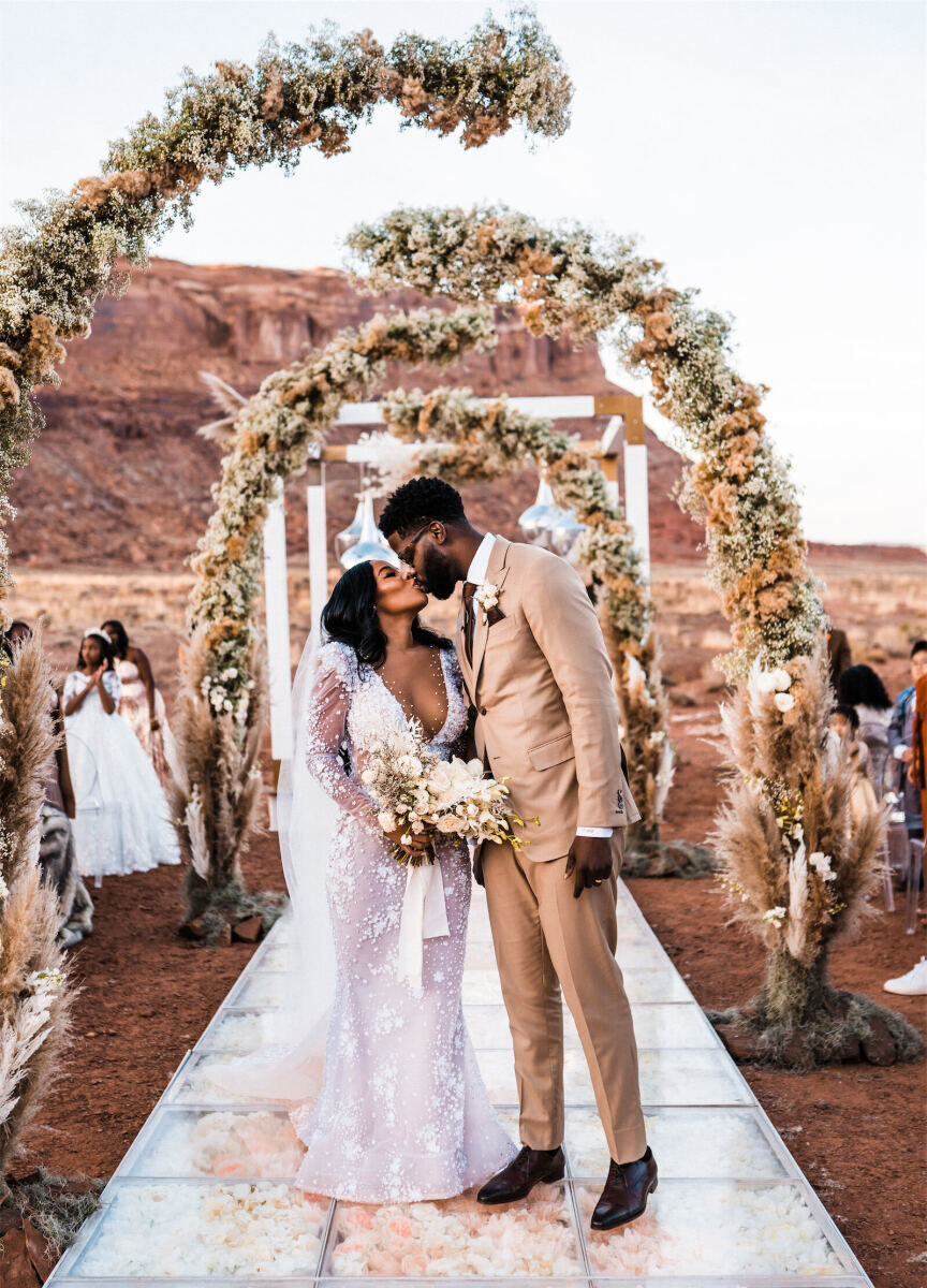 Best Wedding Venues for Creative Couples: A bride and groom kissing at The Red Earth Venue.