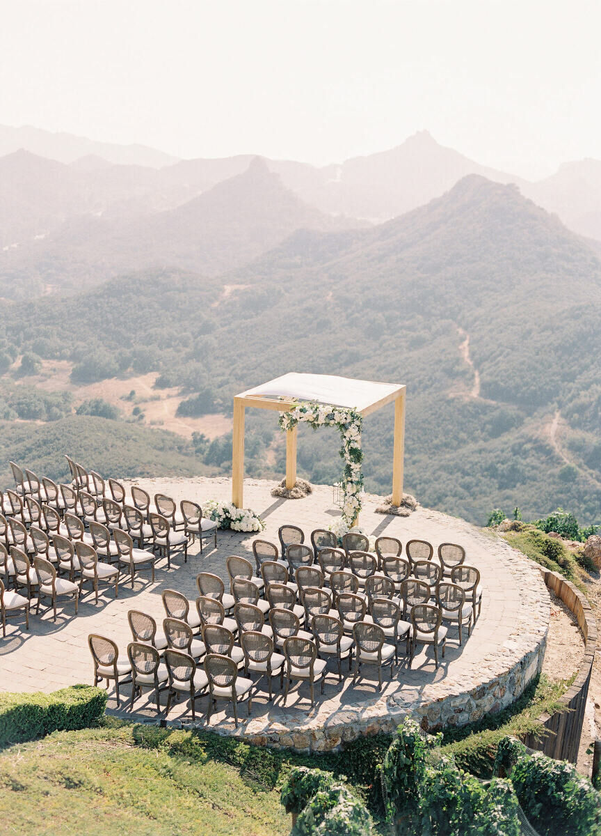 Wedding Venues in California: An outdoor ceremony setup with a square gazebo overlooking the mountains beyond.