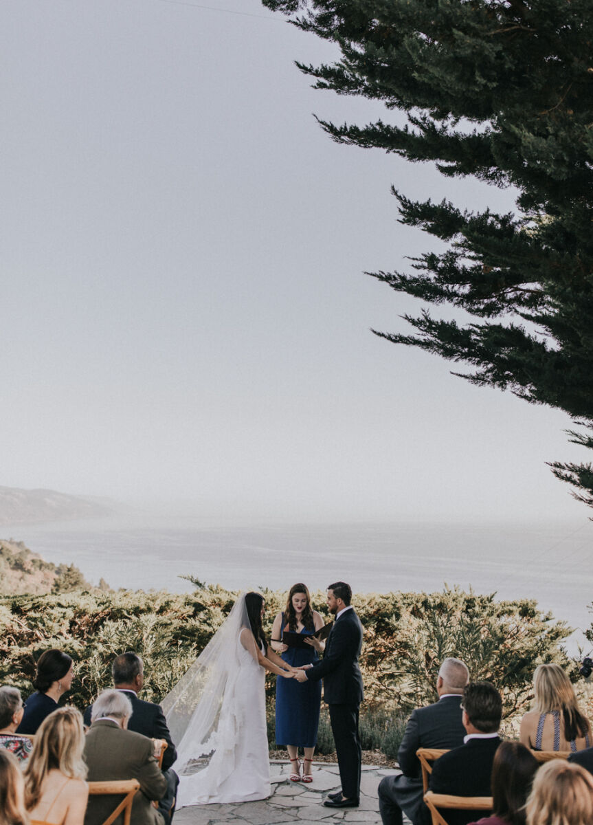 Wedding Venues in California: A wedding couple at the altar of the their ceremony overlooking the ocean in Big Sur, California.