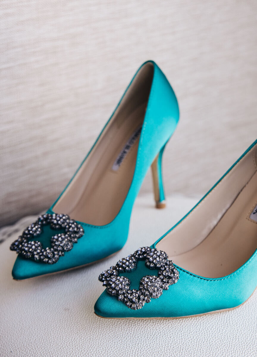 Wedding Website Examples: A pair of teal, jewel-encrusted high heels.