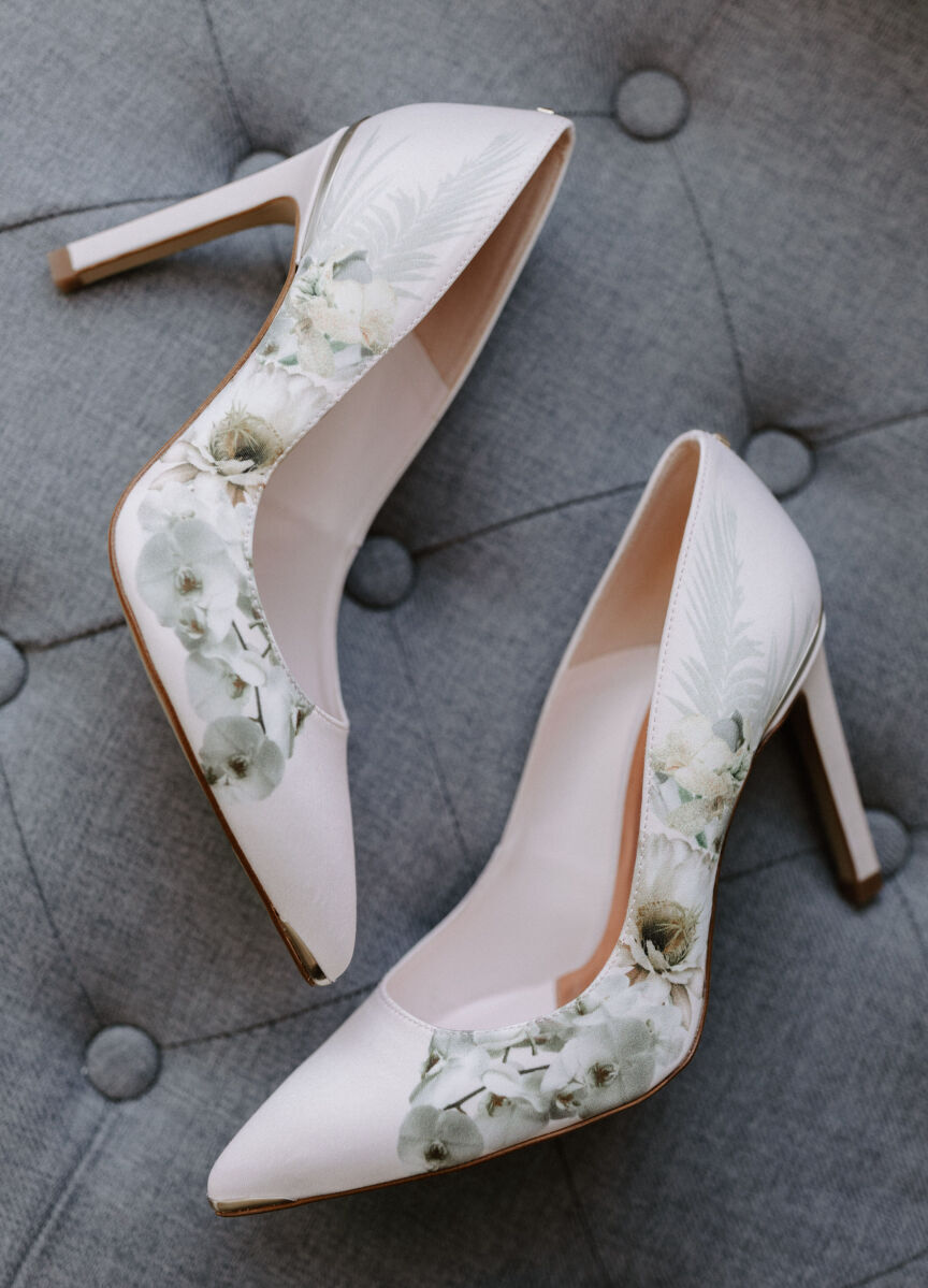 Wedding Website Examples: A pair of floral heels on their side.