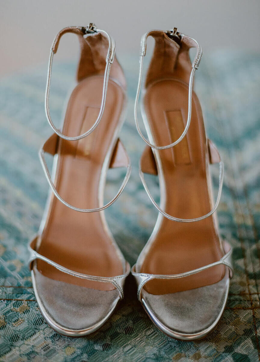 Silver strappy sandals for a bride to wear at her Cabo wedding.