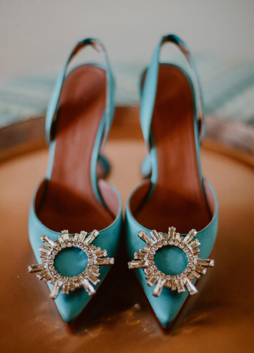 Teal pumps with crystal embellishments for a bride to wear to her wedding reception.