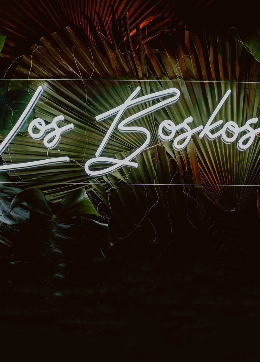 The couple's last name was made into a neon sign for the wedding reception.