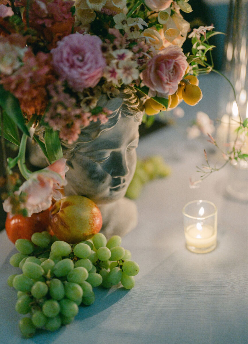 At this whimsical wedding in New Orleans, fresh fruit and flowers were arranged in unique vessels, like a bust of a woman.