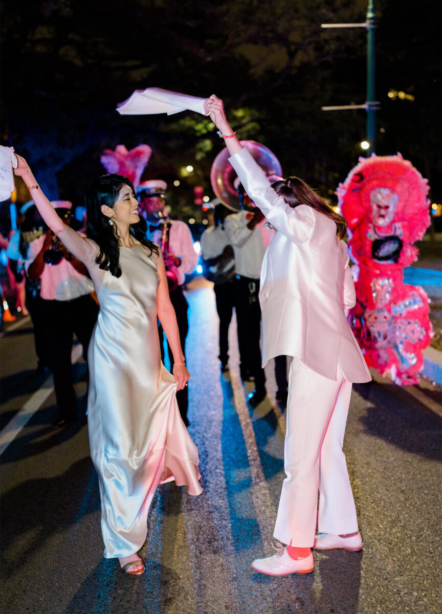 At the end of their whimsical wedding reception, the couple and their guests were led on a second line through the streets of New Orleans by a brass band.