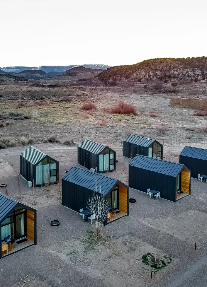 A series of small A-frame cabins at Ofland Escalante in Escalante Utah.