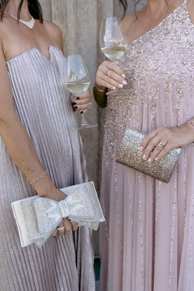 Wedding guest outfit for a cocktail attire wedding, featuring a shimmering sequin dress styled with elegant simplicity and refined polish.