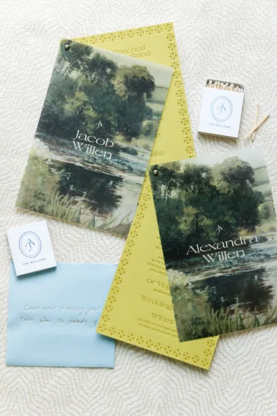 Wedding stationery suite highlighting wedding menu design with a vellum overlay, coordinated pieces arranged in a cohesive flatlay