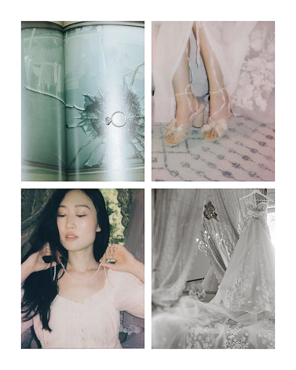 Bridal details with engagement ring photo, shoes, veil, lace wedding dress and pearl necklace arranged by a window on a patterned rug
