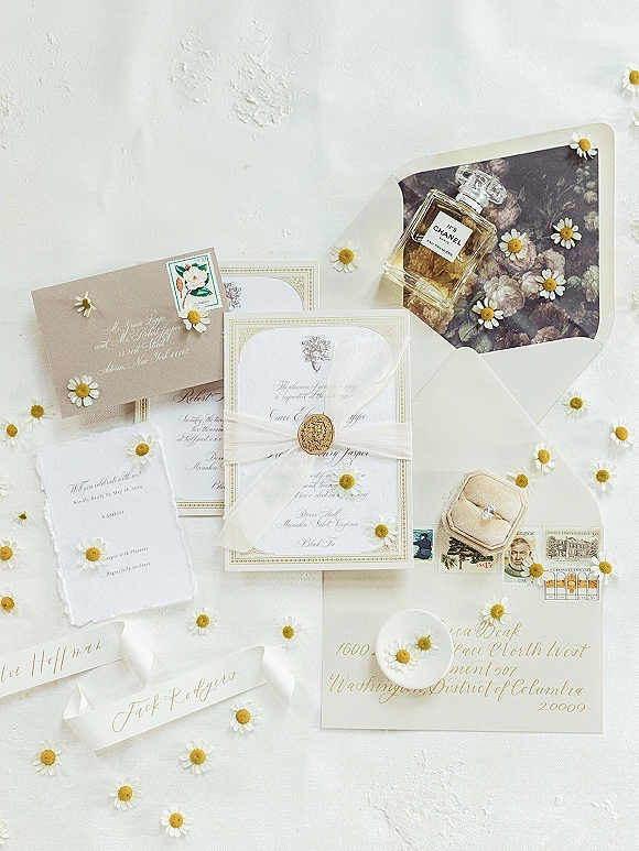 Wedding invitation suite with letterpress wedding invitations, wax seal and sheer ribbon, RSVP card, ring box and daisies on white texture