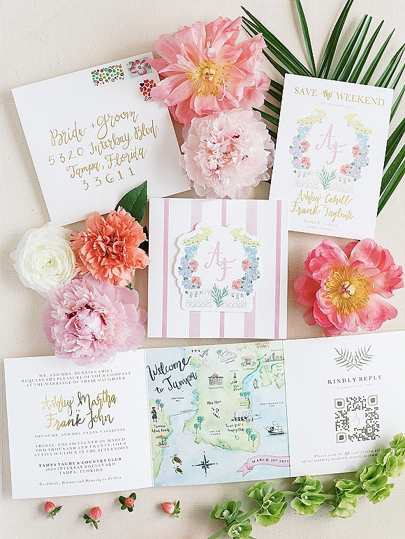 Invitation suite wedding invitation flat lay with pastel cards, wax seal, vintage stamps and peony flowers arranged on linen backdrop