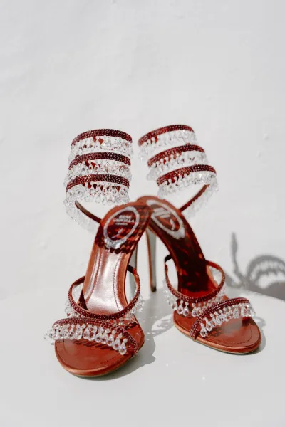 Bridal shoes, strappy wedding sandals with crystal fringe detailing along the straps, ready for the wedding day.
