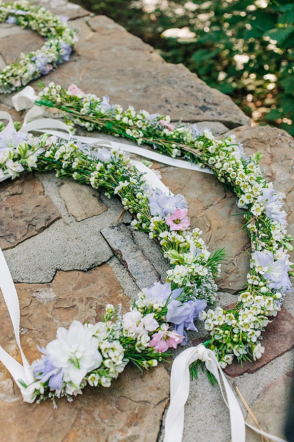 Flower crown bridal flower crown with a white ribbon laid on a stone patio flat lay, surrounded by soft greenery and floral wreaths