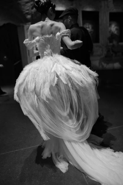 Wedding dress close-up of a feather wedding gown, focusing on the lush textured skirt and delicate detailing.