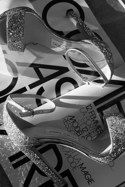 Wedding shoes in silver glitter bridal heels with ankle straps, styled on a fashion magazine flatlay on the floor surface