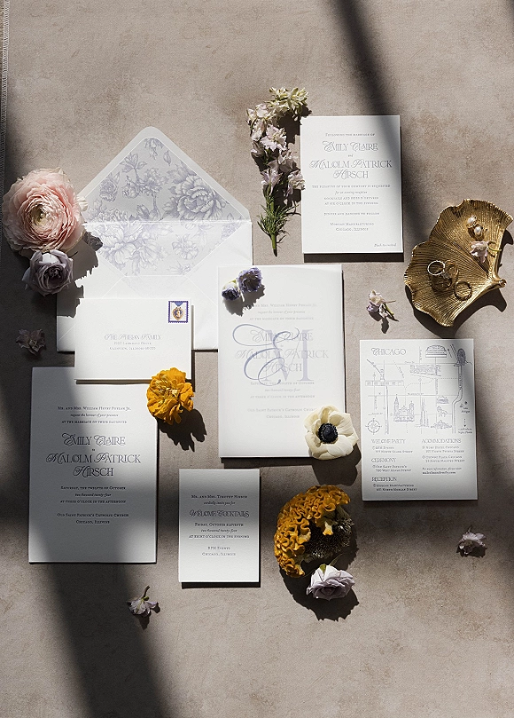 Invitation suite wedding invitation flat lay with RSVP and details cards, floral liner envelope, wax seal, rings on gold dish on linen backdrop