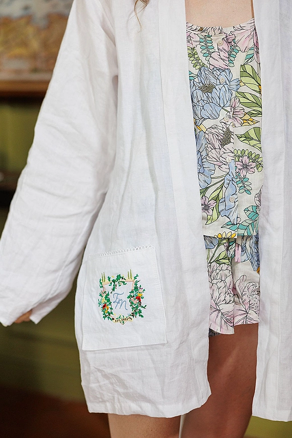 Bridal robe and monogrammed bridal robe with embroidered initials, buttons, and floral pajama set in a cozy indoor room with wall art