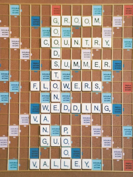 Wedding guestbook scrabble wedding guestbook with letter tiles arranged on a Scrabble board grid for guests to sign and create words