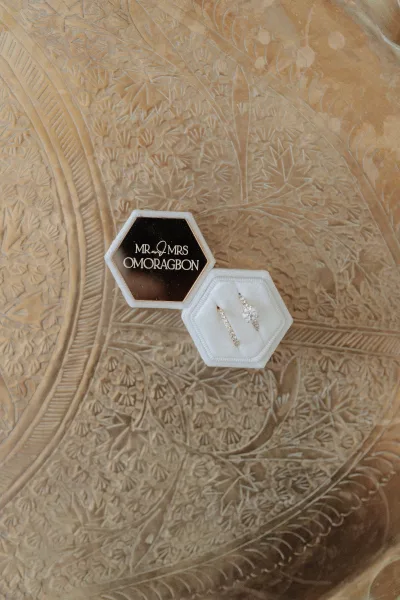 Wedding ring box, a velvet ring box with a monogram lid, styled on an ornate engraved tray, captured in a refined flat lay.