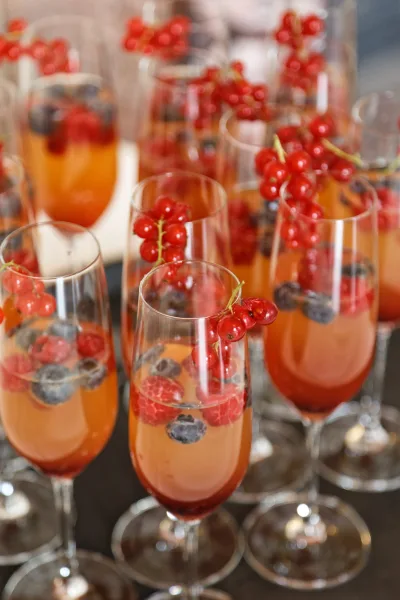 Wedding cocktail for cocktail hour drinks, garnished with red currants for a refined, celebratory touch.
