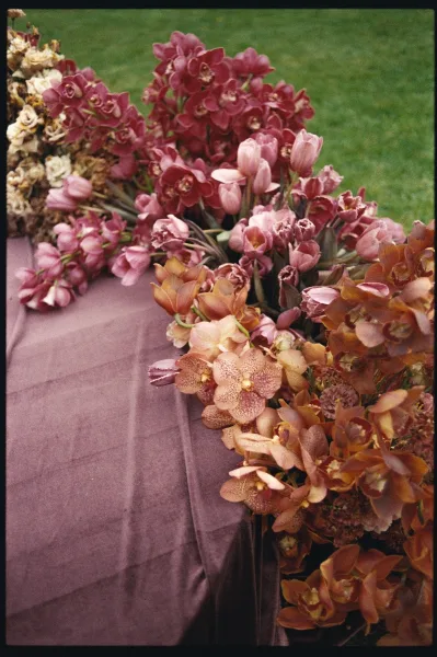 Wedding floral arrangement with orchid wedding flowers in a lush, romantic palette, artfully arranged with soft, tonal pinks.