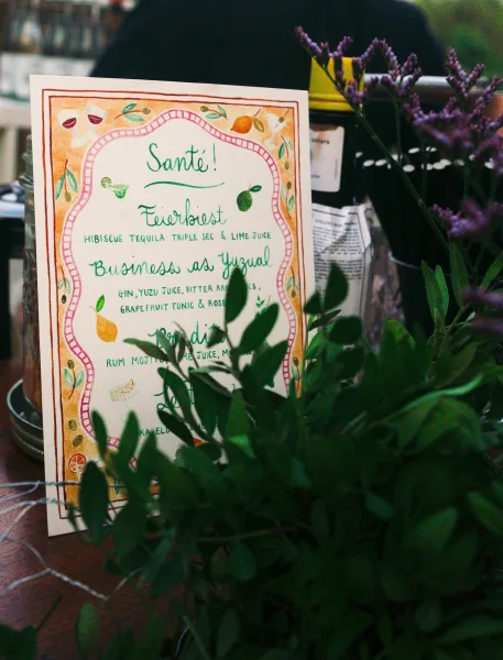 Wedding cocktail menu and signature drink sign, accented by sprigs of lavender for a fresh, romantic touch.