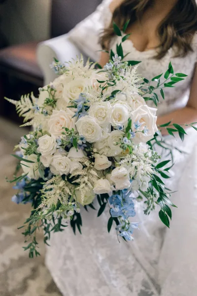 Bridal bouquet, a blue and white bouquet with airy astilbe adding feathery texture and movement to the arrangement.