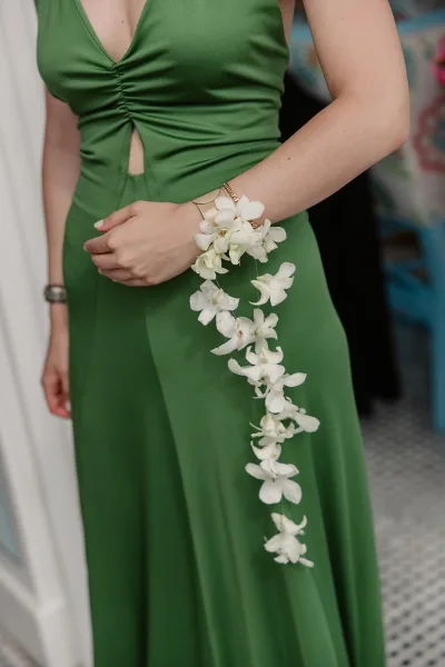 Wrist corsage of orchids resting on the wrist, a refined orchid wrist corsage showcasing delicate blooms.