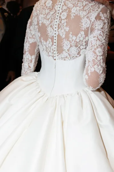 Wedding dress close-up of a lace back wedding dress, highlighting intricate motifs tracing the back in an elegant, timeless style.
