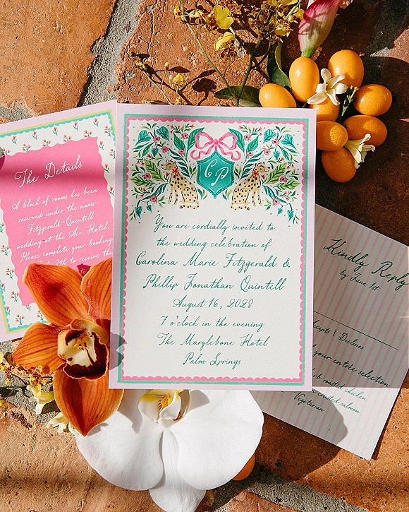 Wedding invitation suite with colorful wedding invitations, calligraphy and floral illustrations, styled with orchids and kumquats on sunlit terracotta tile floor
