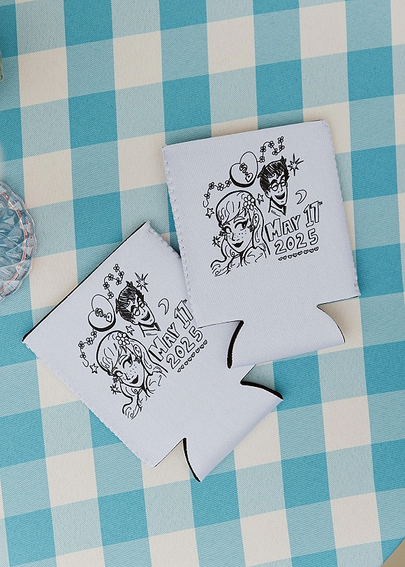 Wedding koozies with custom wedding koozies line-art couple illustration and wedding date in black ink on a blue gingham tablecloth