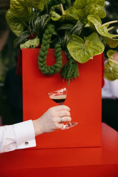 cocktail hour decor styled as a tropical bar arrangement with sculptural anthurium blooms, set against lush garden foliage