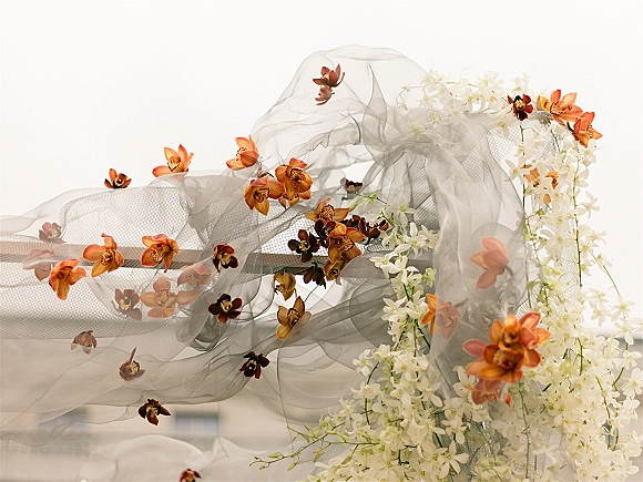 Wedding veil detail with orchid wedding veil appliques on sheer tulle, featuring 3D floral trim against a clean white backdrop