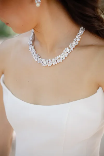 Bridal necklace, a statement wedding necklace, resting on a strapless bridal gown and drawing focus to the elegant neckline.
