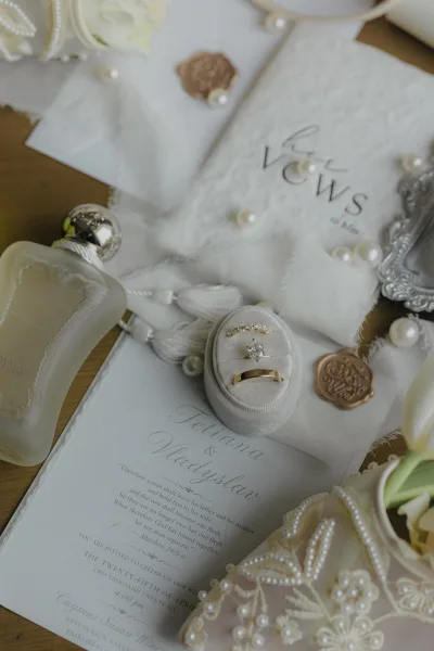 Wedding rings with a classic solitaire engagement ring beside a gold wedding band, styled in a velvet ring box.