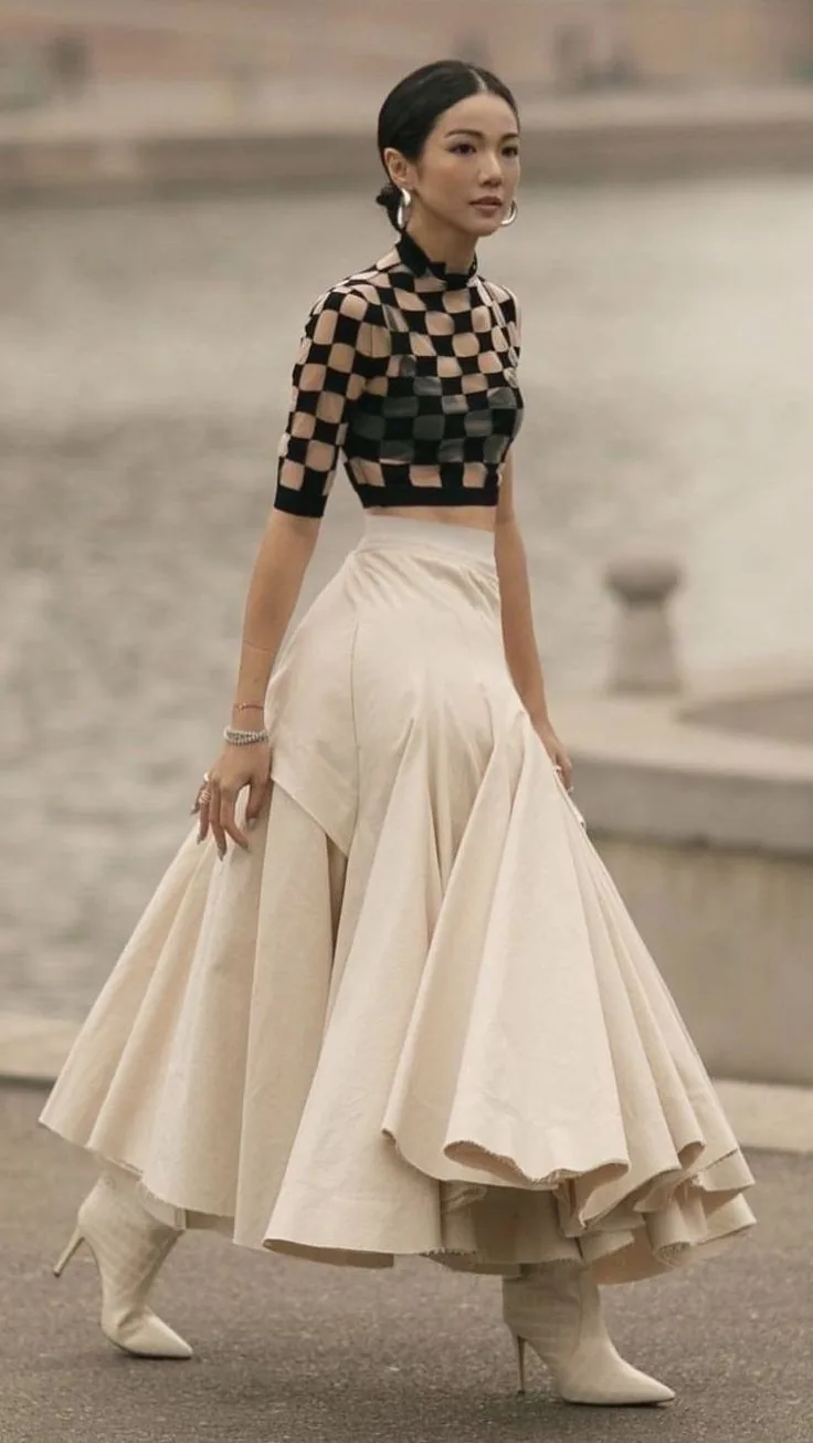 Sheer checkerboard top with a full cream skirt and white boots